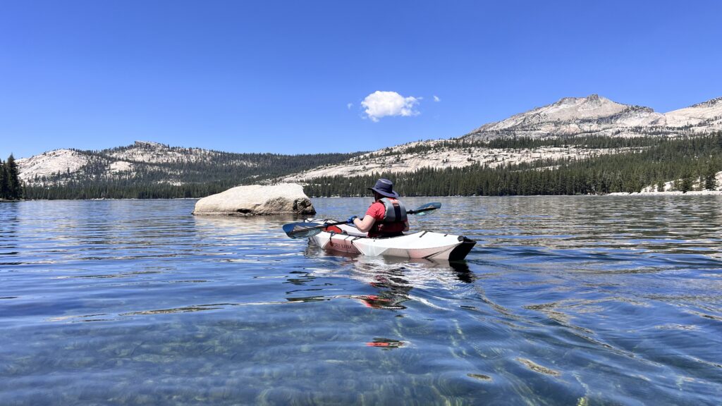 A kayaker paddles on Tenaya Lake in Yosemite